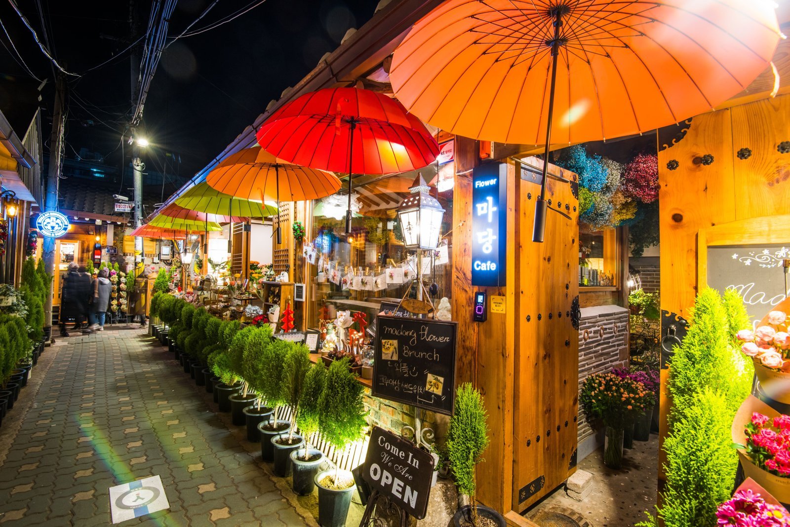 Ikseon-dong by night: the same alley turns into a different neighborhood under the lights and parasols